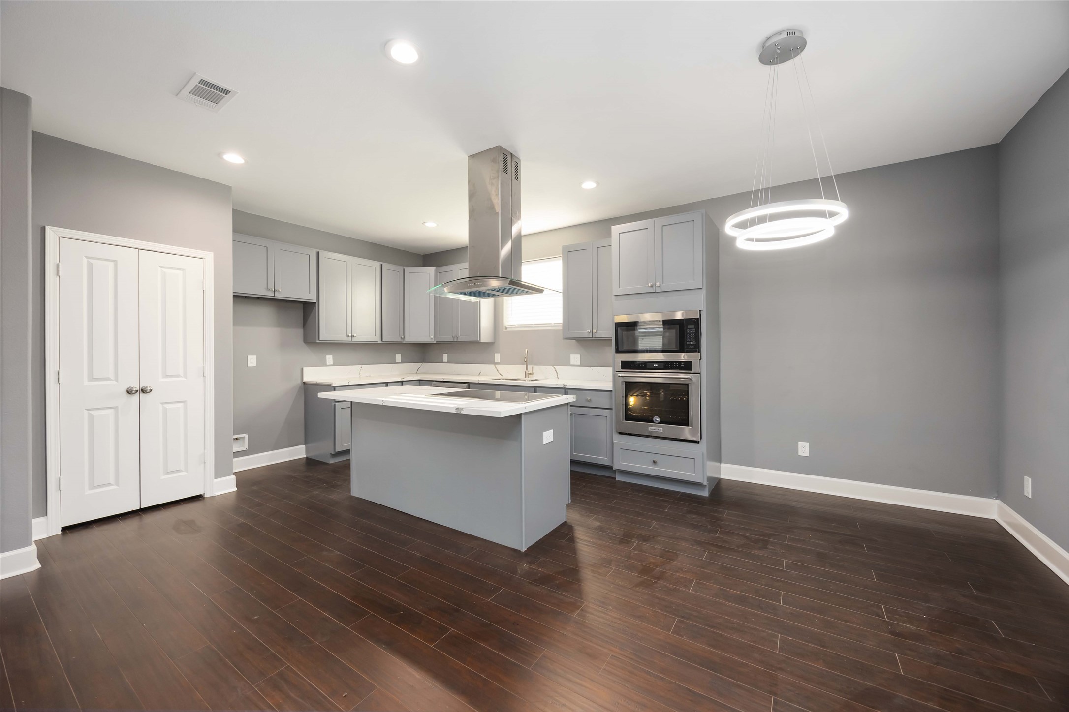 813 Fortune Street Houston, TX 77088 - Photo 23 of 27 a kitchen with a refrigerator and white cabinets