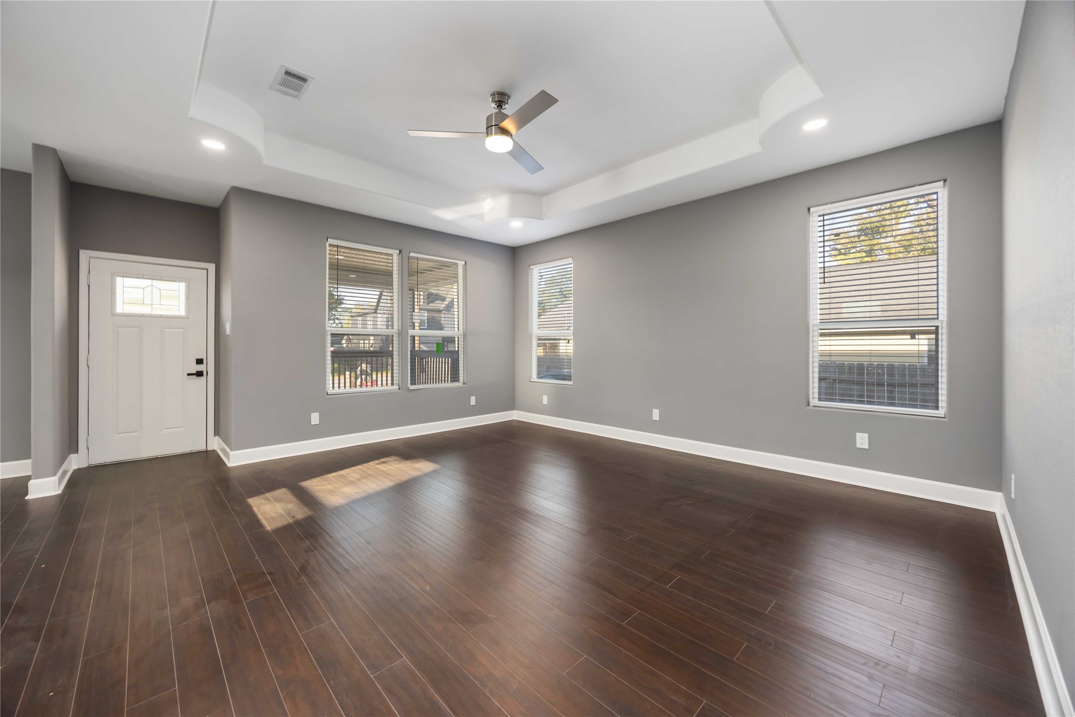 813 Fortune Street Houston, TX 77088 - Photo 3 of 27 a view of an empty room with wooden floor and a window