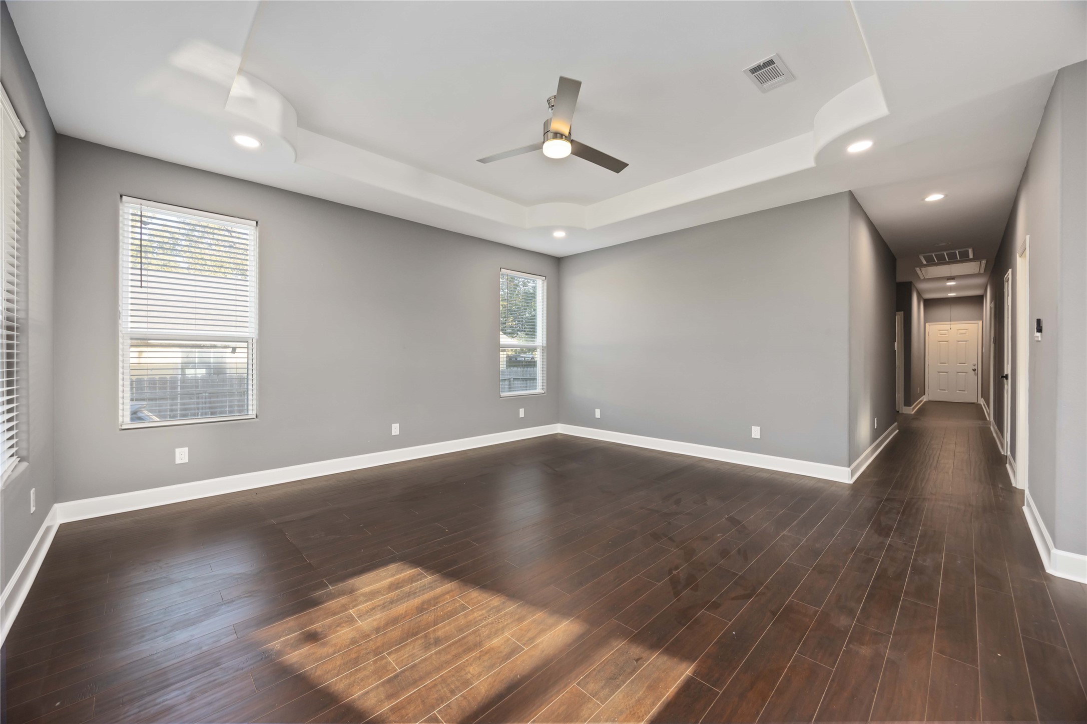 813 Fortune Street Houston, TX 77088 - Photo 4 of 27 a view of an empty room with wooden floor and a window