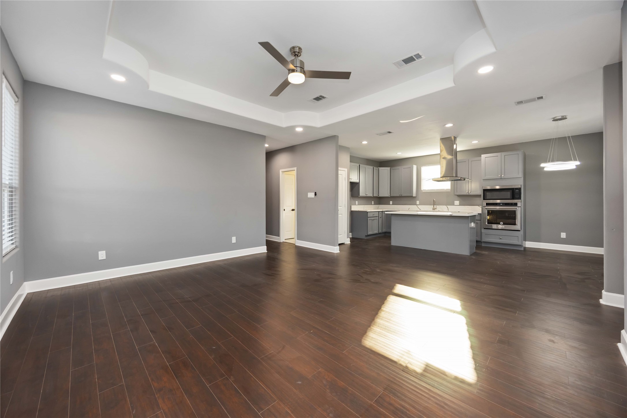 813 Fortune Street Houston, TX 77088 - Photo 5 of 27 a view of kitchen with cabinets and wooden floor
