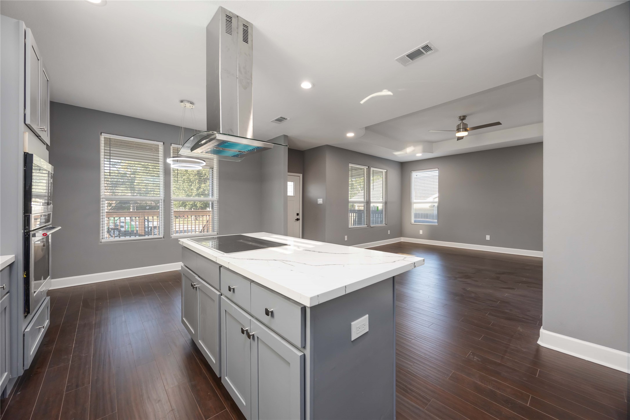 813 Fortune Street Houston, TX 77088 - Photo 9 of 27 a kitchen with a stove and wooden floor