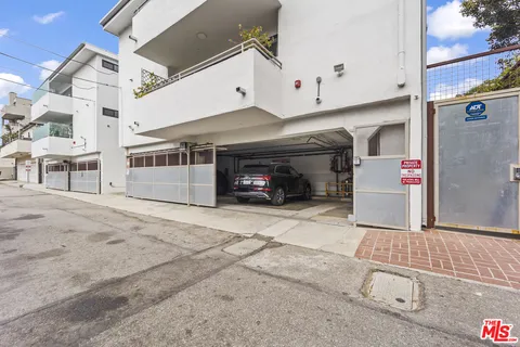 a view of a car park in front of a building