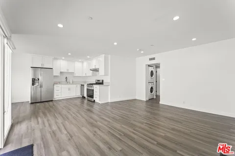 a view of kitchen with wooden floor
