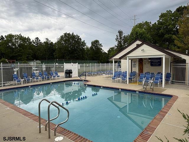 81 Flounder Ocean View, NJ 08230 - Photo 18 of 20 a view of a lake with a table and chairs