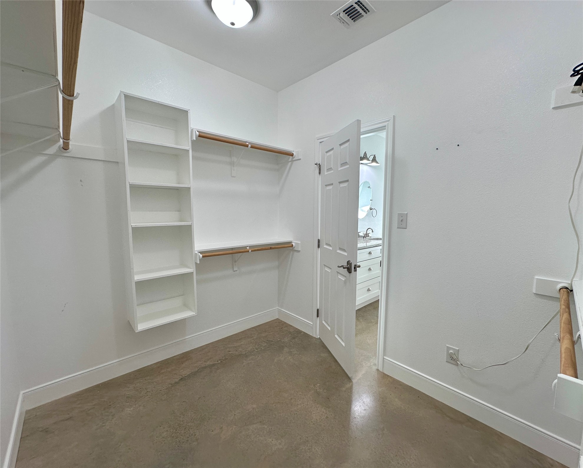 124 Pine Path Bastrop, TX 78602 - Photo 10 of 31 Walk in closet featuring built-ins