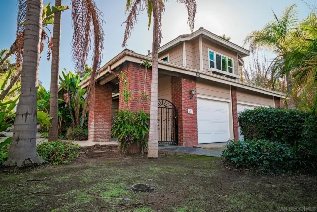 a living room with furniture a chandelier and a rug