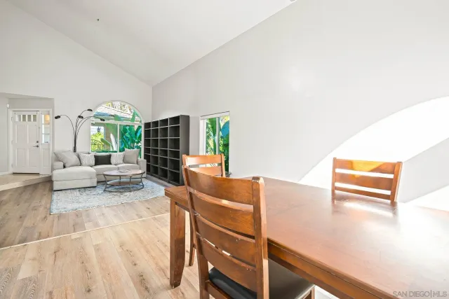 a kitchen with granite countertop a stove a sink and a refrigerator
