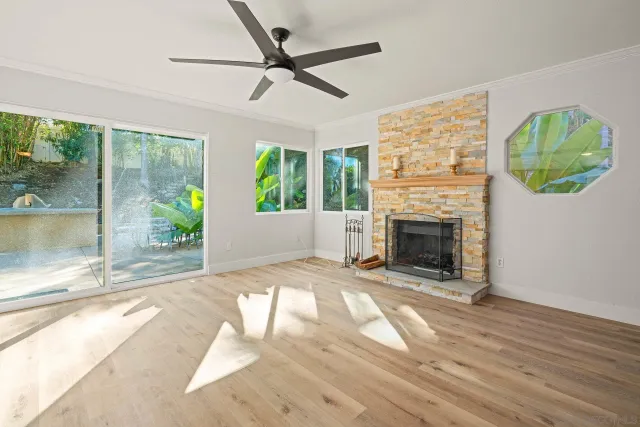 a room with pool table and windows