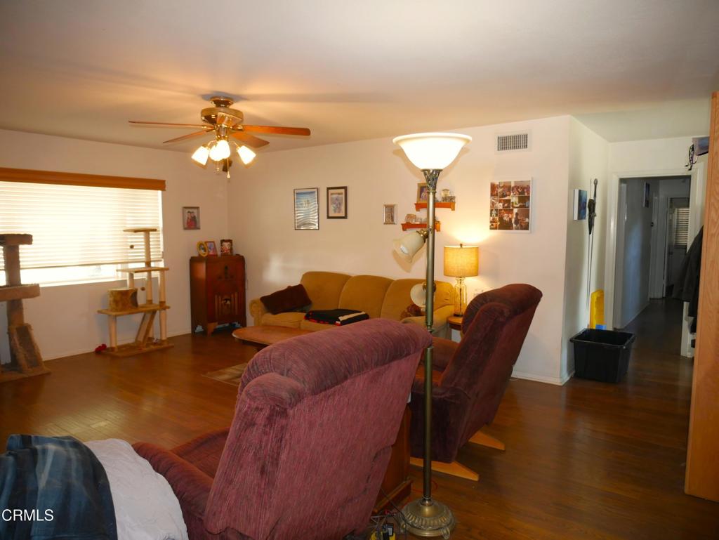 1772 Weston Circle Camarillo, CA 93010 - Photo 15 of 36 a living room with furniture a dining table and wooden floor