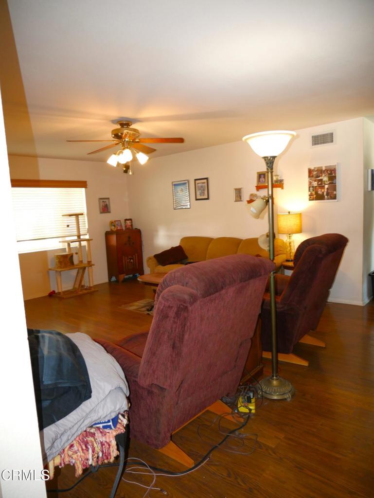 1772 Weston Circle Camarillo, CA 93010 - Photo 16 of 36 a living room with furniture and a chandelier