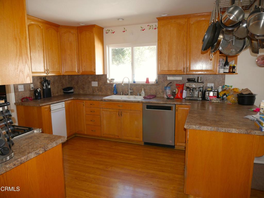 1772 Weston Circle Camarillo, CA 93010 - Photo 17 of 36 a kitchen with a sink a stove and cabinets