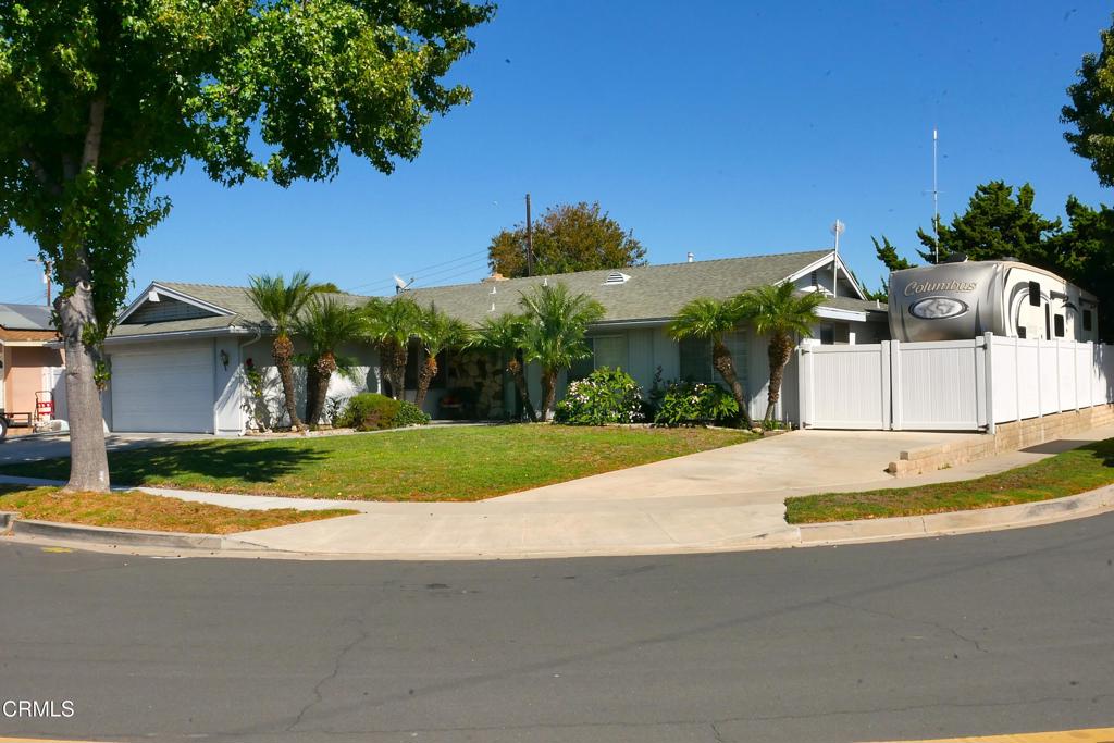 1772 Weston Circle Camarillo, CA 93010 - Photo 2 of 36 a view of the house with palm trees and a small yard