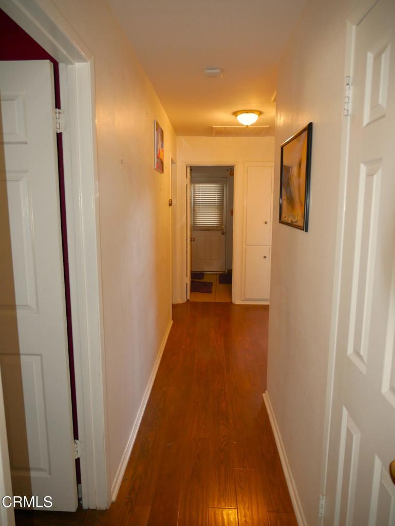 1772 Weston Circle Camarillo, CA 93010 - Photo 27 of 36 a view of a hallway with wooden floor and staircase