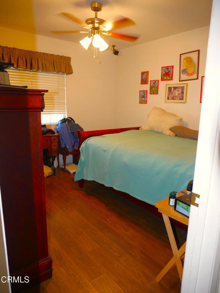 1772 Weston Circle Camarillo, CA 93010 - Photo 28 of 36 a room with wooden floor and furniture