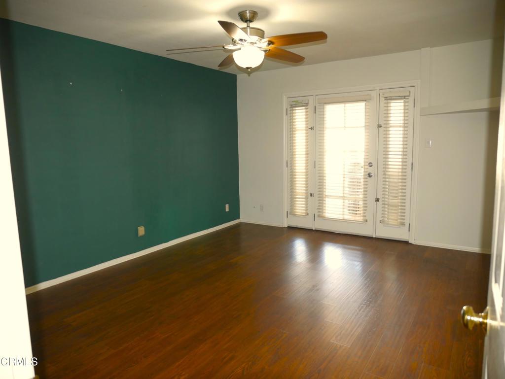 1772 Weston Circle Camarillo, CA 93010 - Photo 31 of 36 an empty room with wooden floor fan and windows