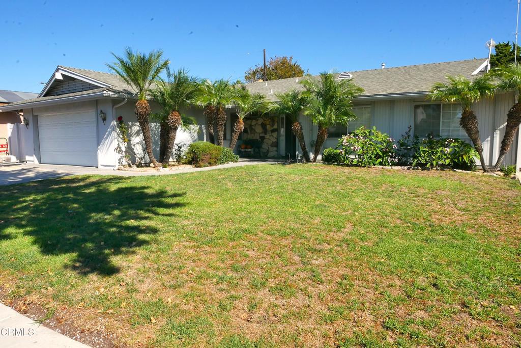1772 Weston Circle Camarillo, CA 93010 - Photo 6 of 36 a view of a house with a yard and palm trees
