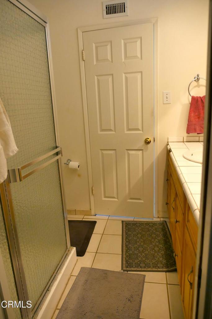1772 Weston Circle Camarillo, CA 93010 - Photo 9 of 36 a bathroom with a granite countertop shower and a sink