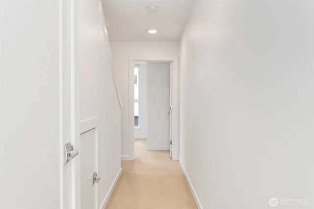 a view of a hallway with a white walls