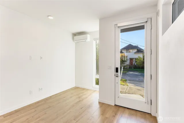 an empty room and wooden door