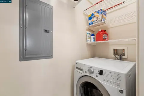 a kitchen with a stove cabinets and wooden floor