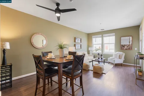 a view of a dining room with furniture and a chandelier