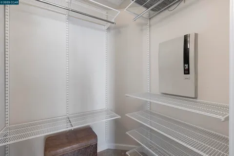 a bathroom with a granite countertop sink mirror and a toilet
