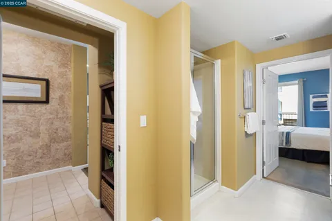 a view of a balcony with furniture and front door