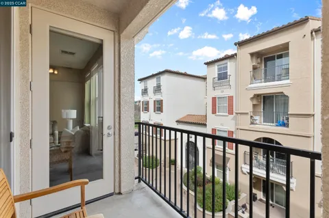 a front view of a building with glass windows and a table