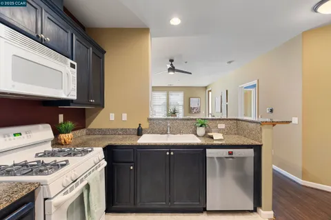 a view of bathroom with a sink toilet and wooden tub