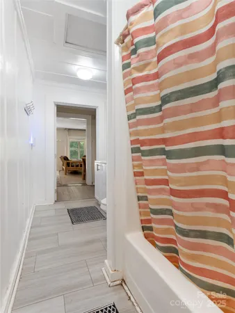 a view of front door with stairs and a rug