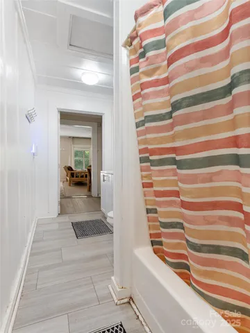 a view of front door with stairs and a rug