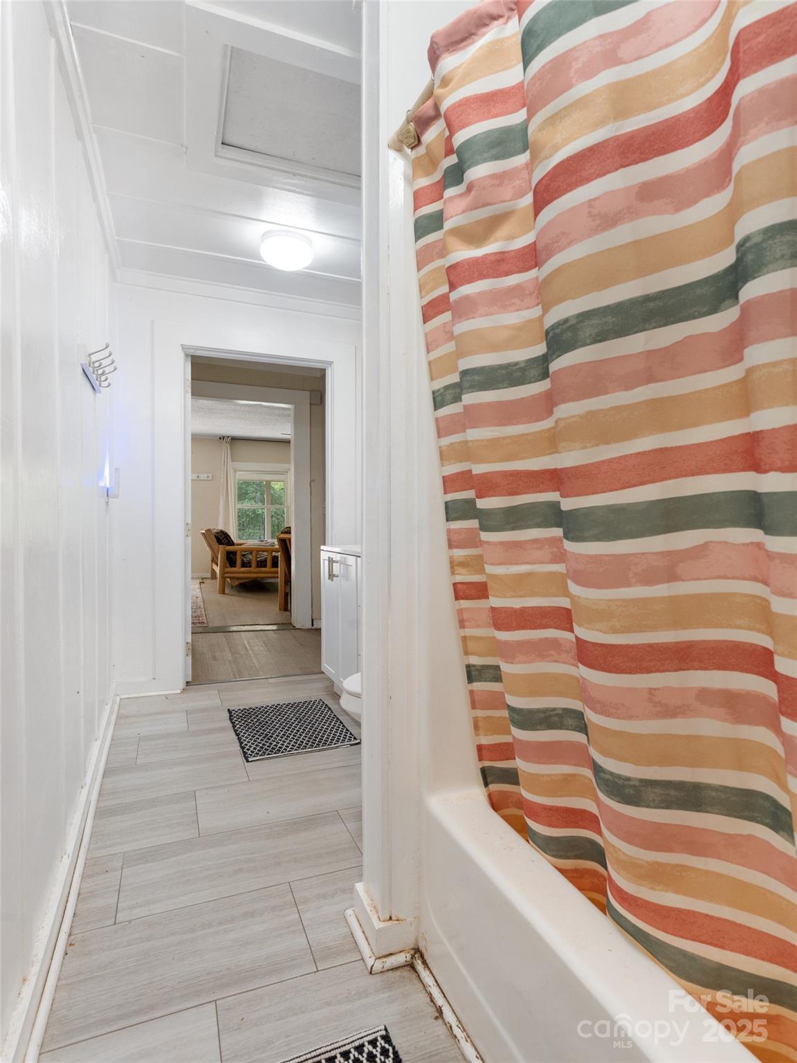 1343 Solen Williams Road Tryon, NC 28782 - Photo 11 of 17 a view of front door with stairs and a rug