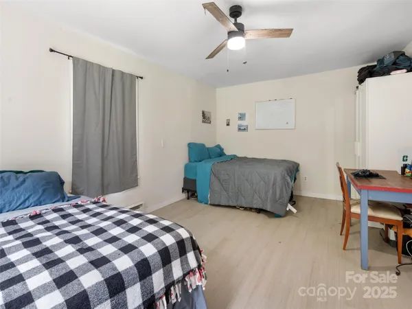 a bedroom with a bed and a chair