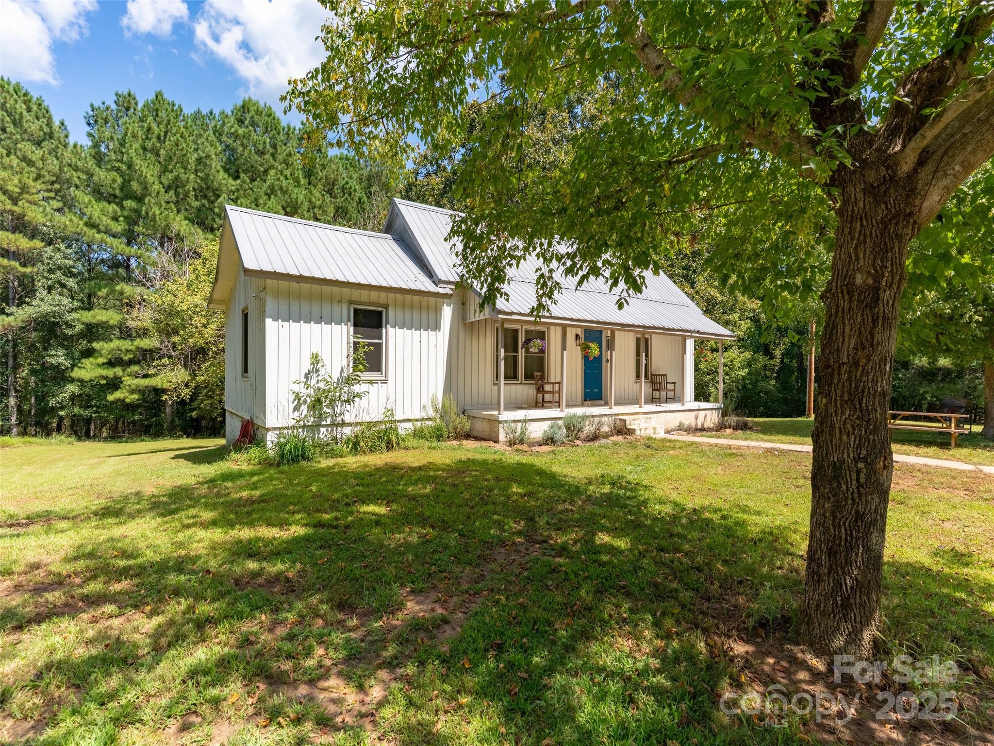 1343 Solen Williams Road Tryon, NC 28782 - Photo 2 of 17 a front view of house with yard and green space