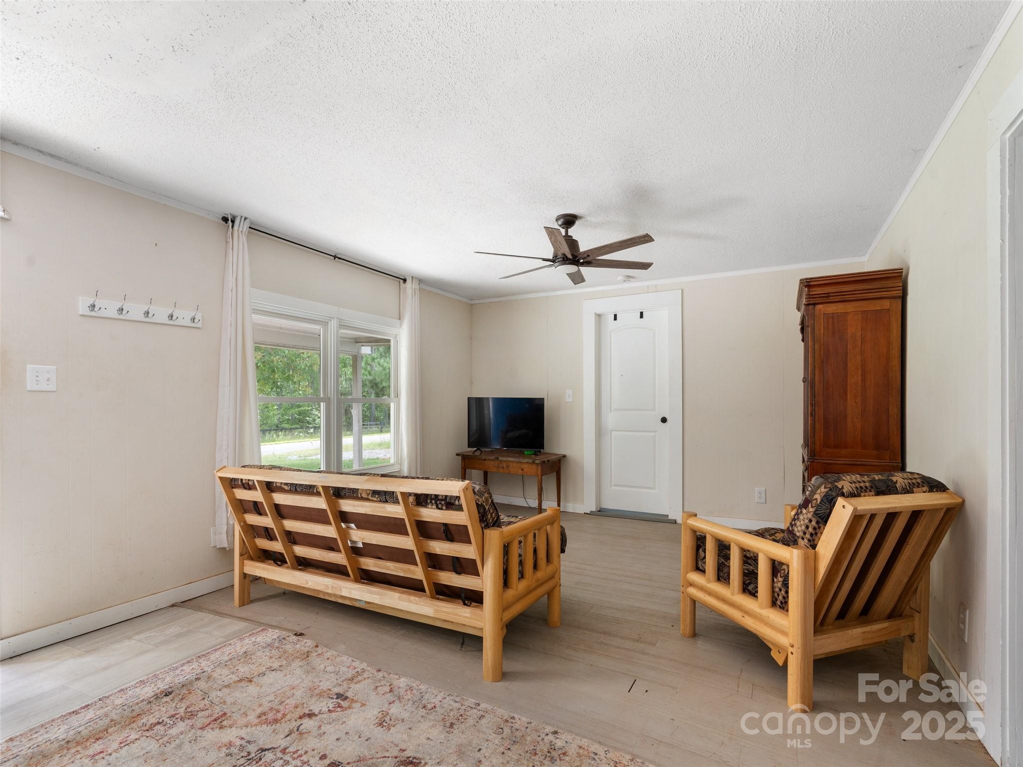 1343 Solen Williams Road Tryon, NC 28782 - Photo 5 of 17 a bedroom with a bed and a chandelier