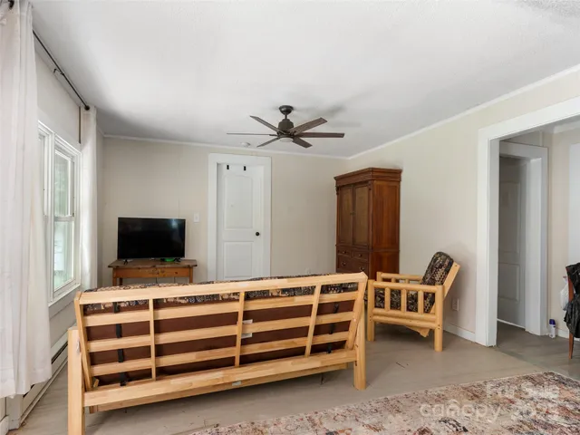 a bedroom with furniture and window