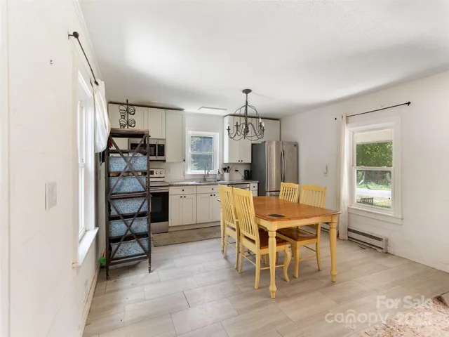 a view of a dining room with furniture
