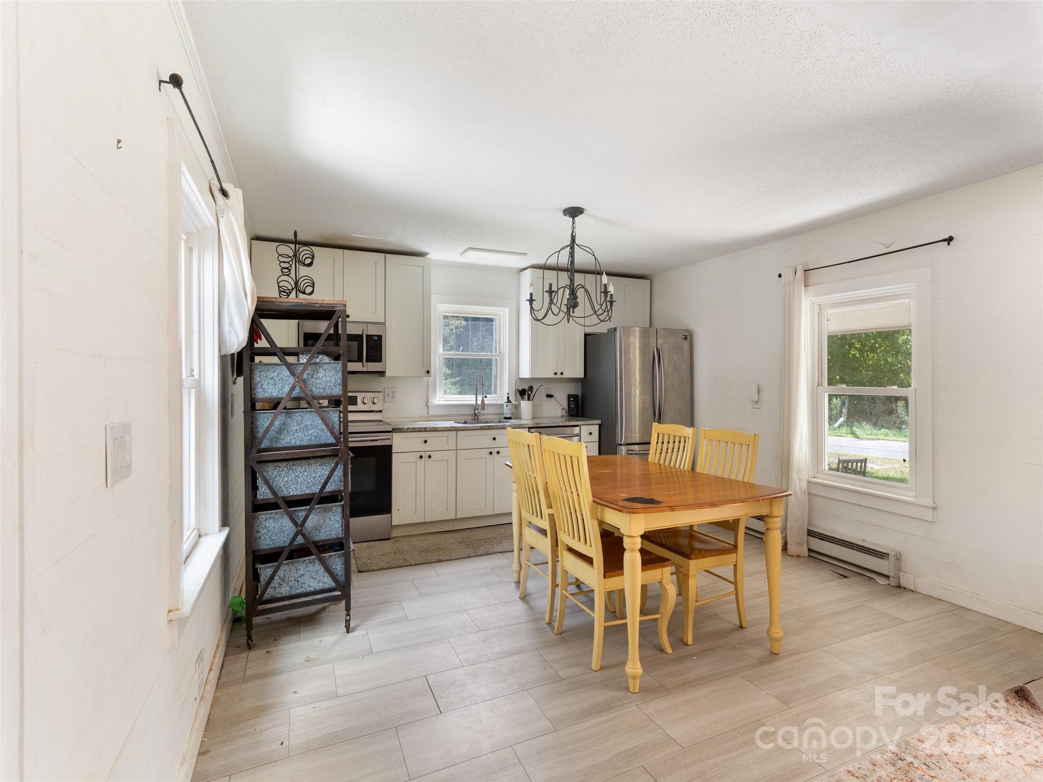1343 Solen Williams Road Tryon, NC 28782 - Photo 8 of 17 a view of a dining room with furniture