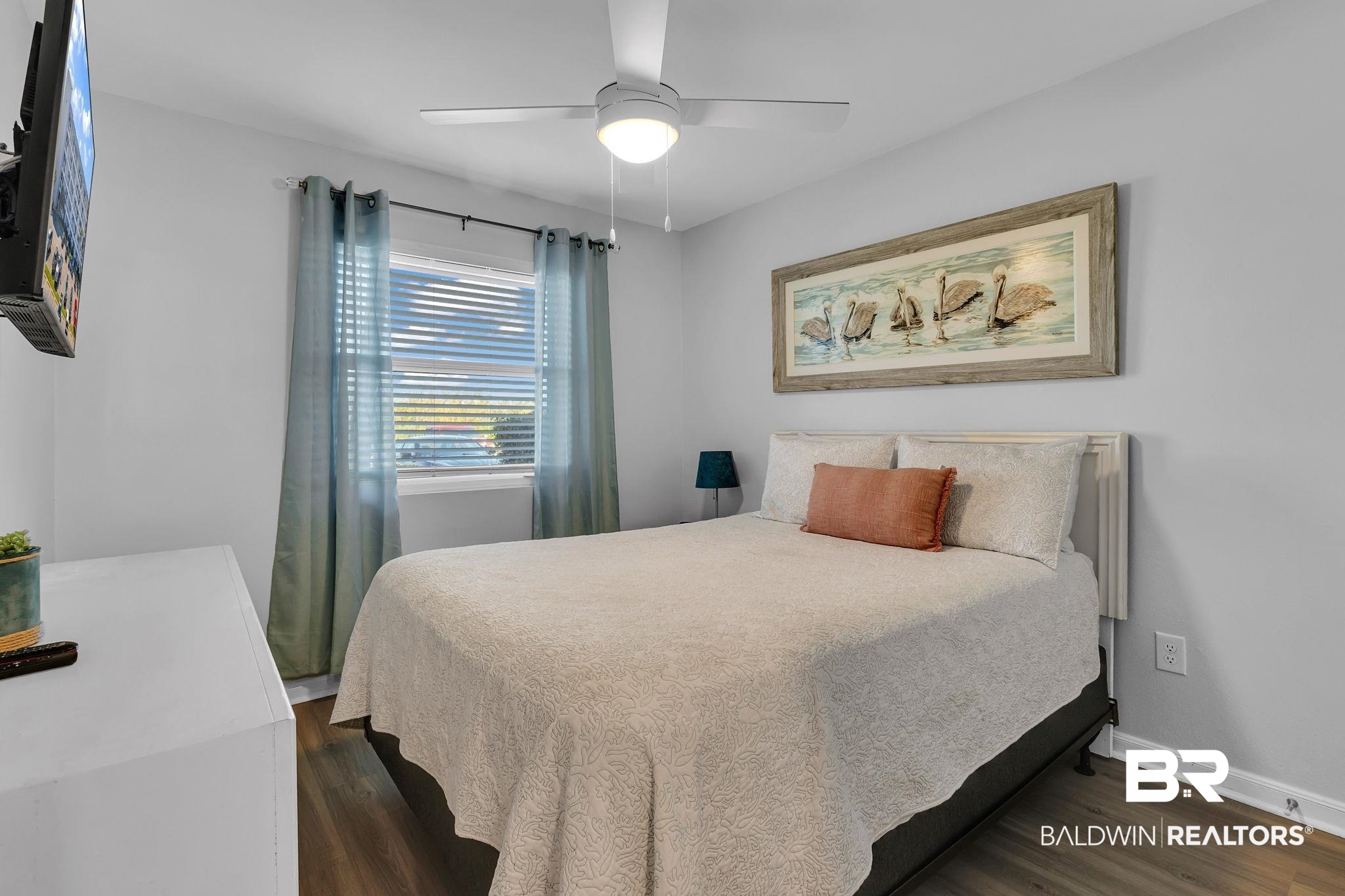 400 Plantation Road, Unit 4115 Gulf Shores, AL 36542 - Photo 16 of 48 Bedroom with ceiling fan and dark wood-type flooring