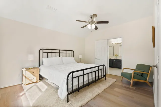 a bedroom with a bed and a chair