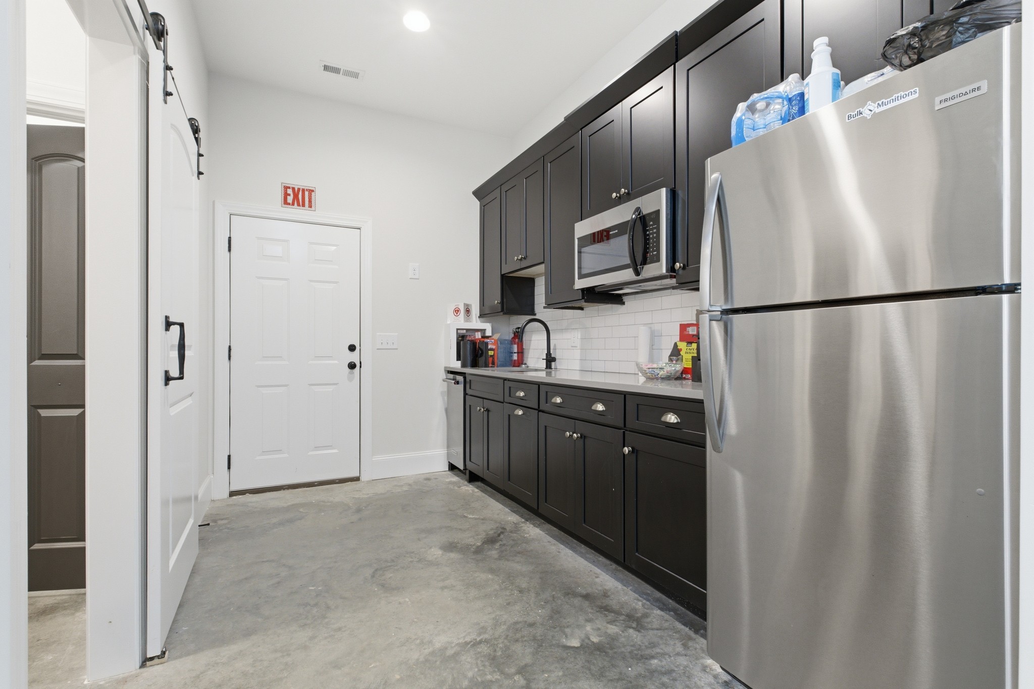 7075 Pinewood Road Nunnelly, TN 37137 - Photo 42 of 49 a kitchen with stainless steel appliances a refrigerator and a sink