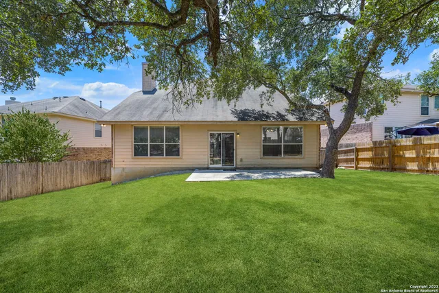 a backyard of a house with seating space