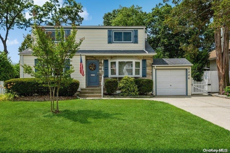 2206 Redmond Road Merrick, NY 11566 - Photo 1 of 1 a view of a house with a yard and a garden
