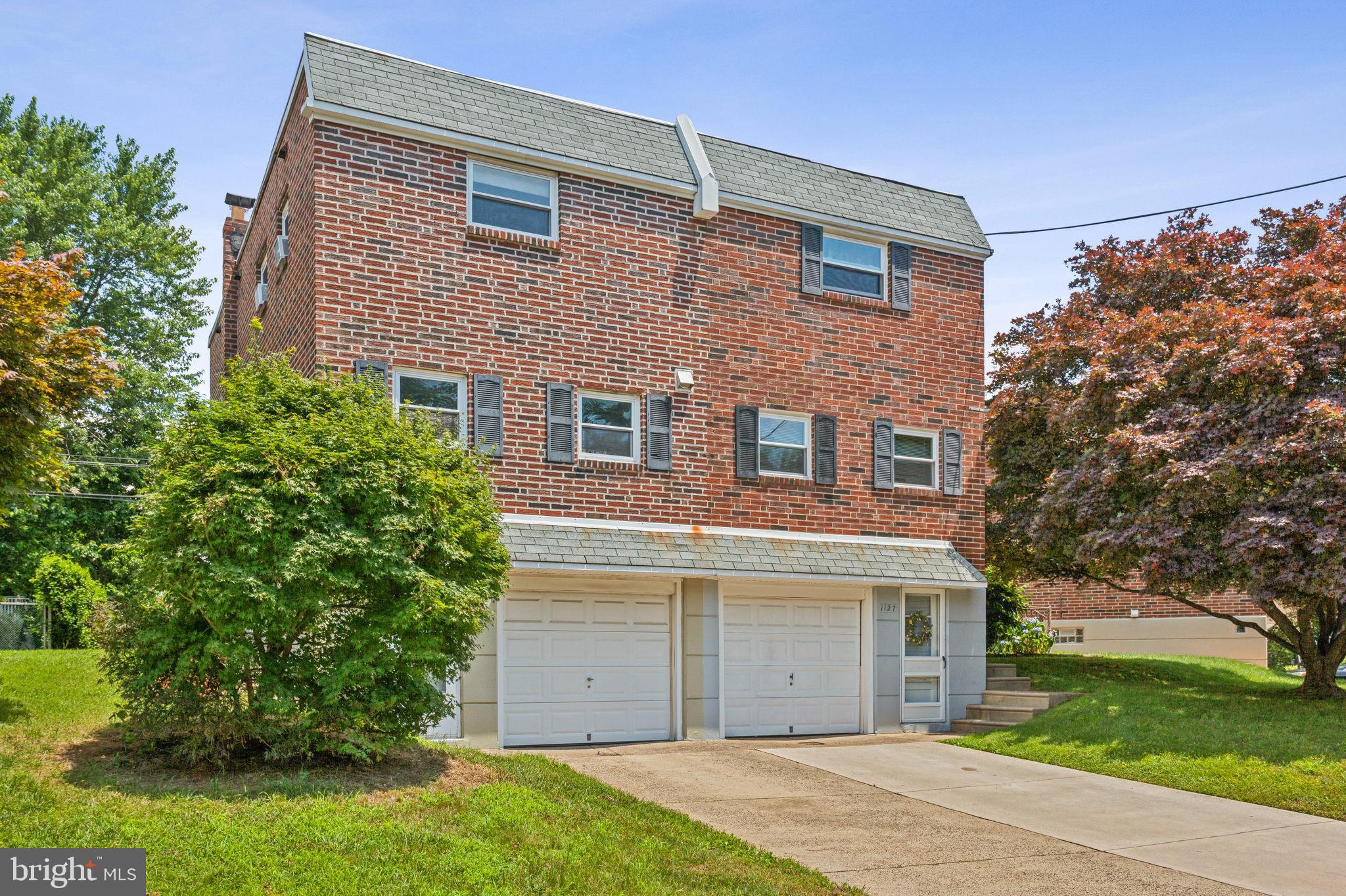 front view of a house and a yard