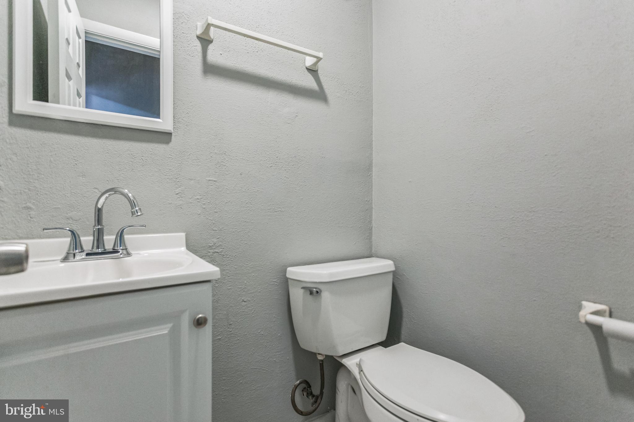 1125 Solly Avenue Philadelphia, PA 19111 - Photo 18 of 49 a bathroom with a toilet sink and mirror