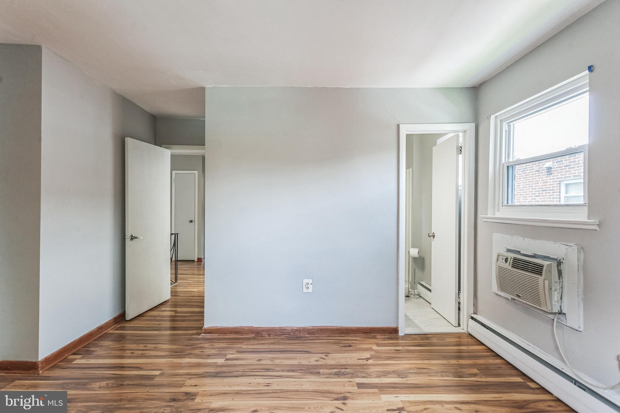 1125 Solly Avenue Philadelphia, PA 19111 - Photo 19 of 49 a view of an empty room with wooden floor and a window
