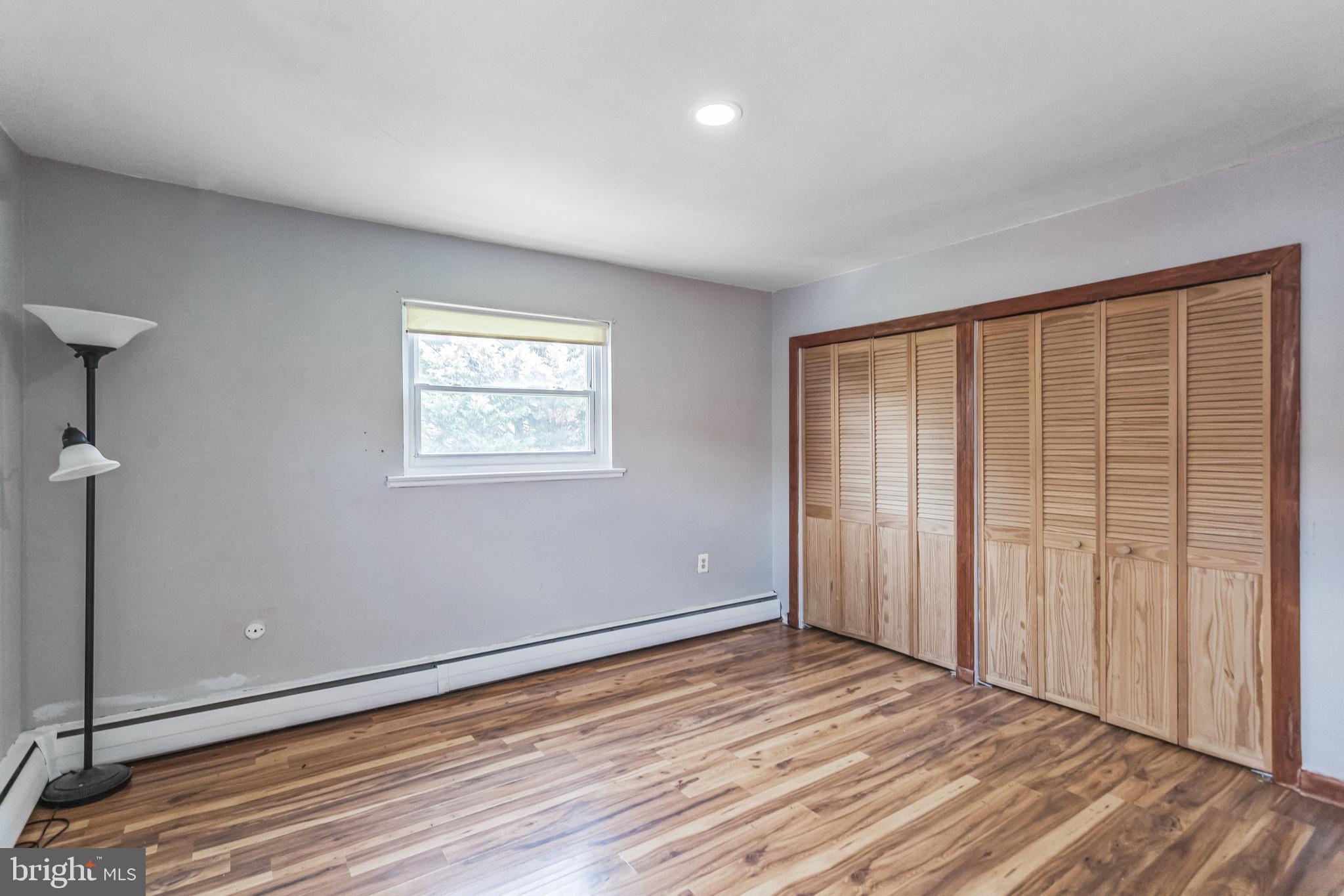 1125 Solly Avenue Philadelphia, PA 19111 - Photo 20 of 49 a view of an empty room with wooden floor and a window