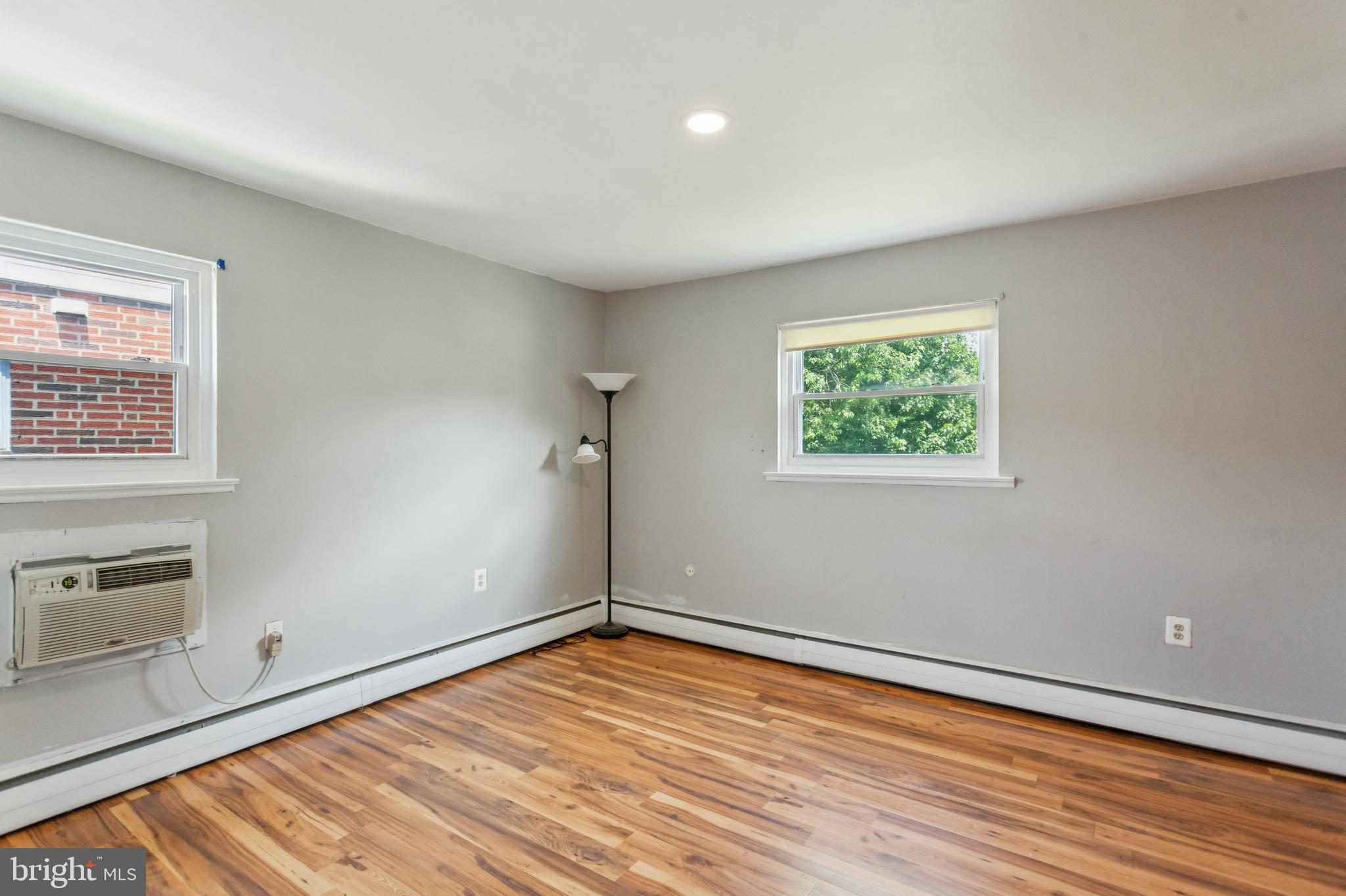 1125 Solly Avenue Philadelphia, PA 19111 - Photo 21 of 49 wooden floor in an empty room with a window