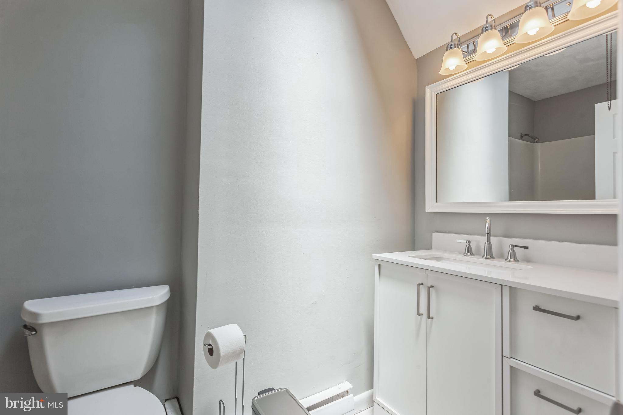 1125 Solly Avenue Philadelphia, PA 19111 - Photo 22 of 49 a bathroom with a toilet sink and mirror