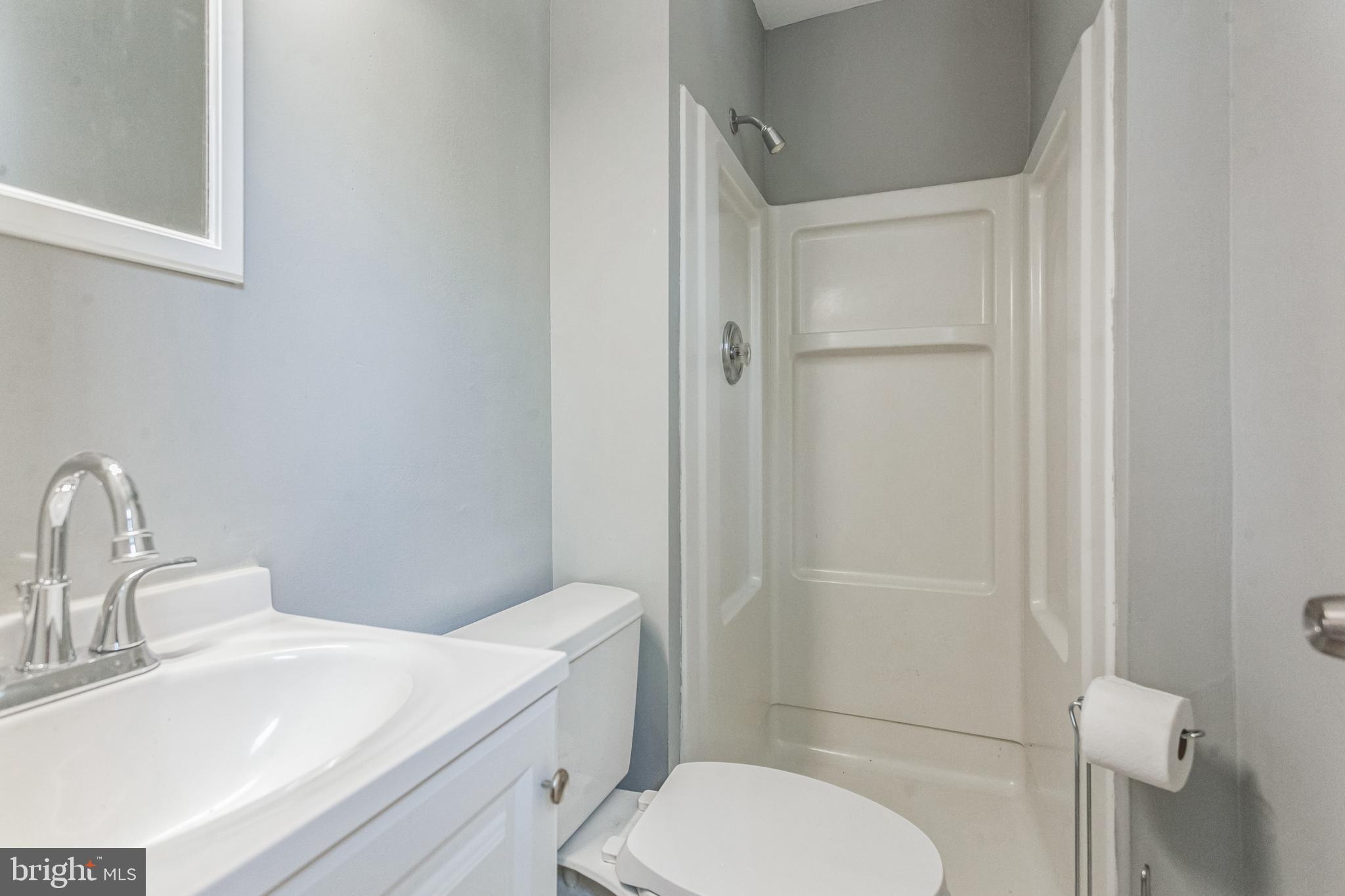 1125 Solly Avenue Philadelphia, PA 19111 - Photo 28 of 49 a bathroom with a toilet a sink and shower